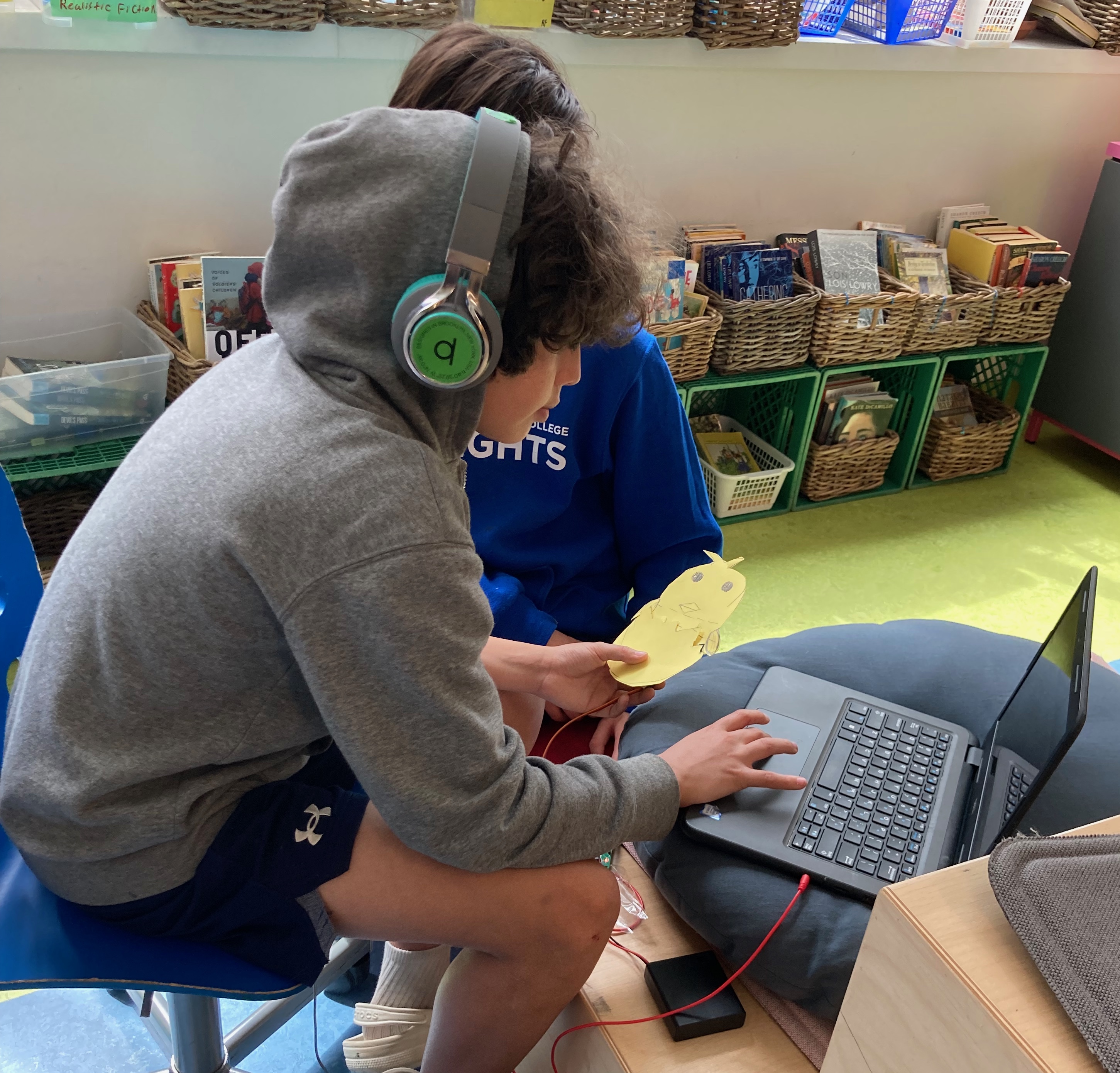 Grade 6 student Hiro recording audio to control his chick puppet